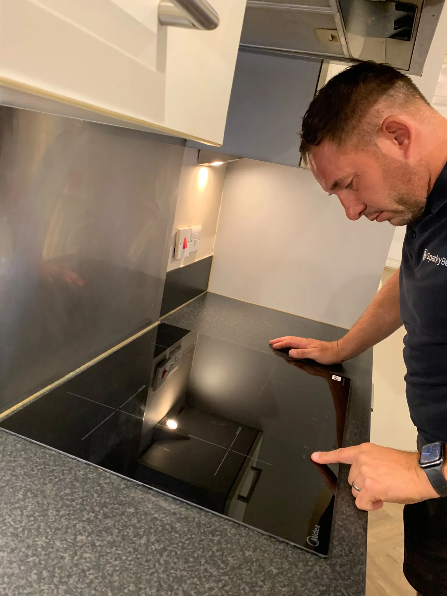 Ben fitting the new induction hob to replace the old electric hob